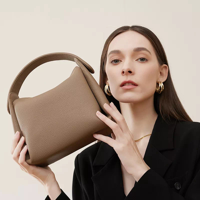 Classic style leather crossbody bag with convenient top handle