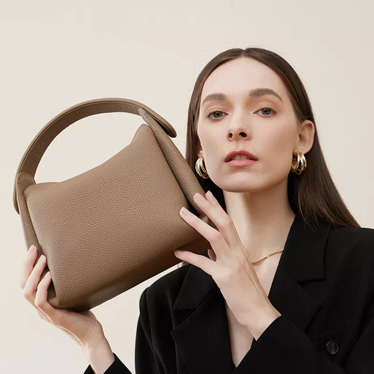 Classic style leather crossbody bag with convenient top handle