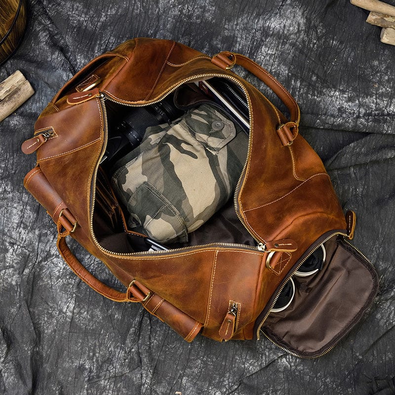 Classic brown leather travel bag with crossbody strap