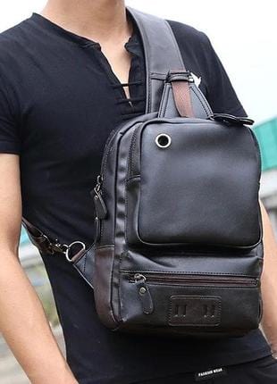 Luxury crossbody leather backpack with an urban aesthetic