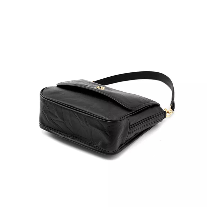 How to style a classic leather shoulder bag with two straps