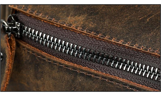 Men's brown genuine leather travel backpack with 15.6 inch laptop compartment 20 to 35 liters