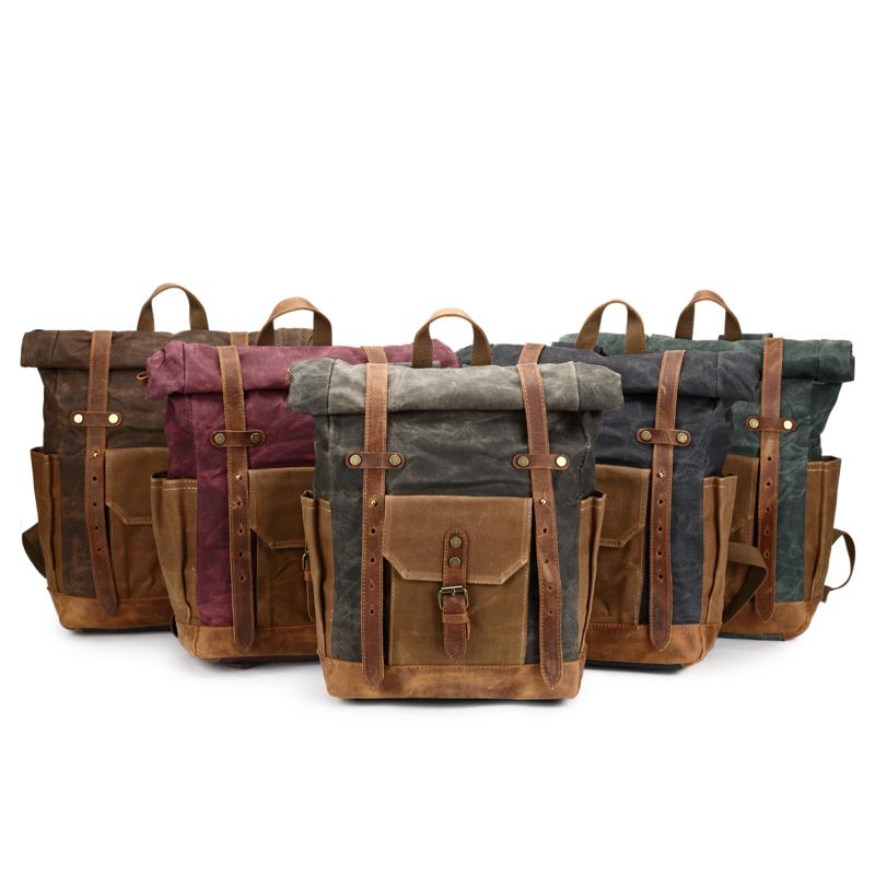 Large canvas leather laptop backpack with waterproof feature for 14-inch laptop