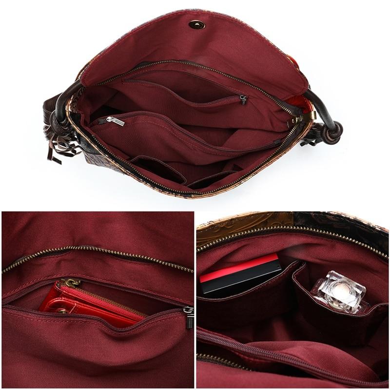 Leather daypack or sling bag for ladies with floral embossed details on patchwork design