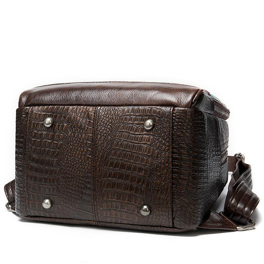 Men's multi-color leather backpack with embossed patterns and patchwork design