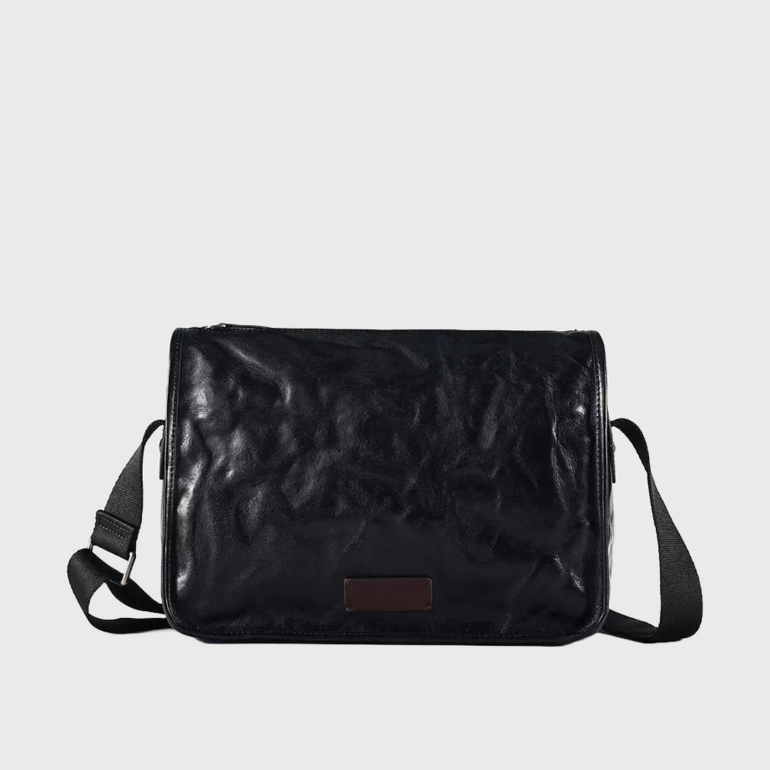 Stylish black vegetable-tanned leather crossbody bag