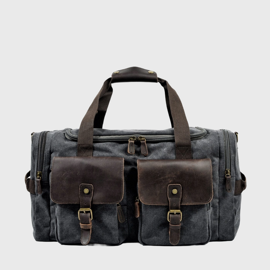 Vintage canvas and leather duffle travel bag