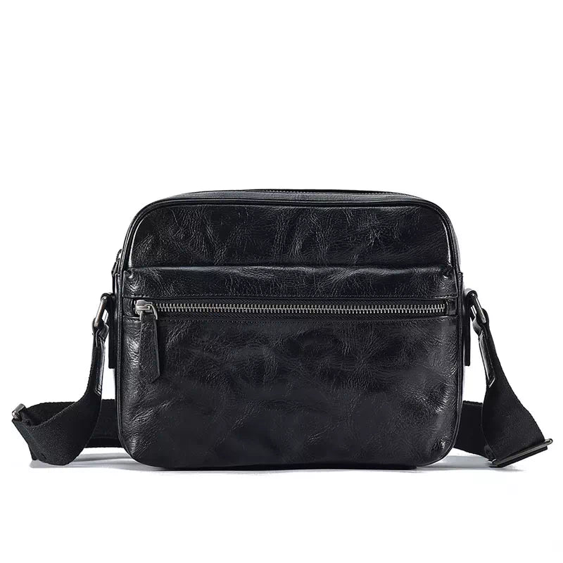 Small crossbody bag in black crafted from vegetable-tanned leather