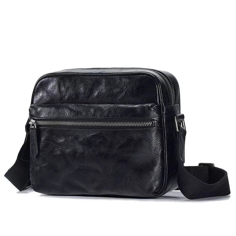 Compact crossbody bag in black with vegetable-tanned leather