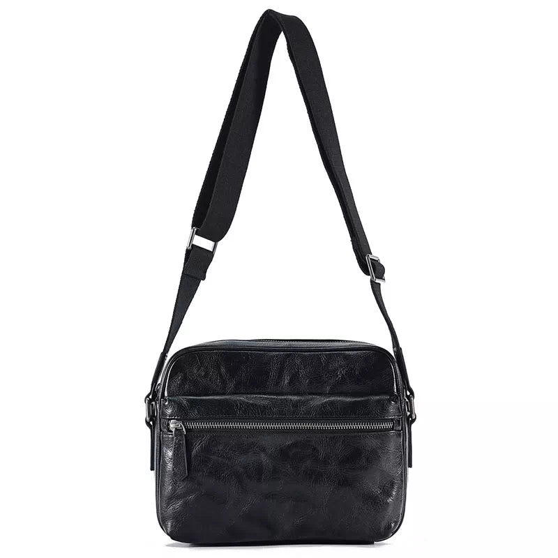 Tiny black crossbody bag with vegetable-tanned leather construction