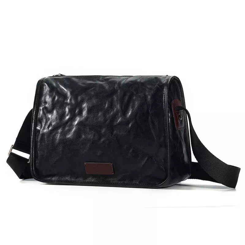 Chic black leather crossbody bag with vegetable-tanned finish