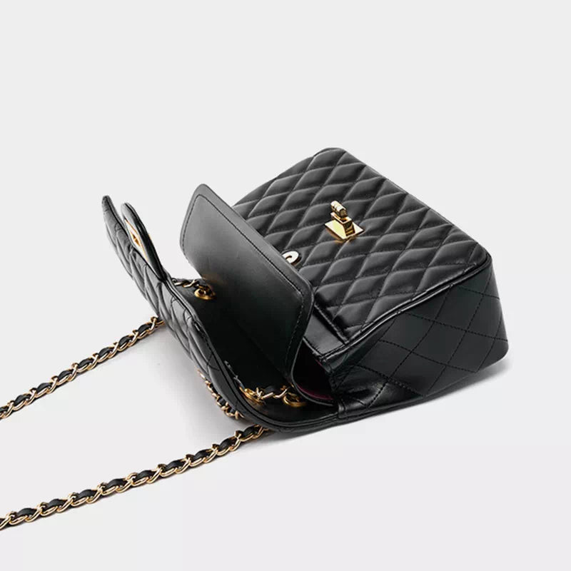 Stylish ways to accessorize with black leather shoulder bags and chains