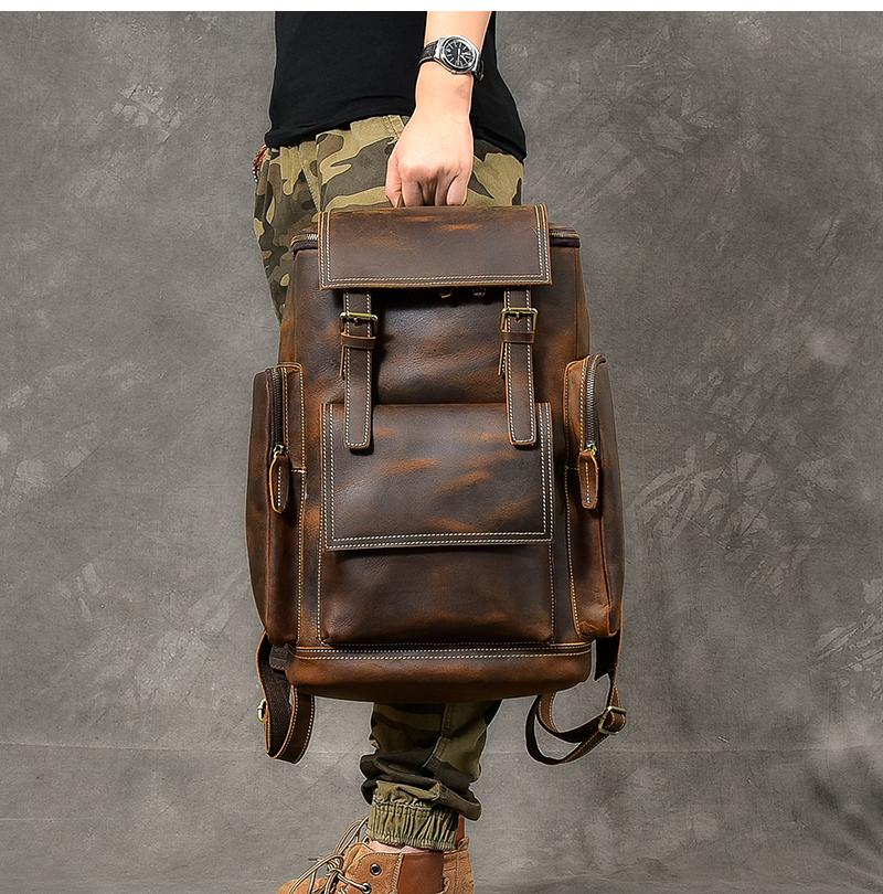 Vintage brown leather travel backpack with 36-55L capacity for men