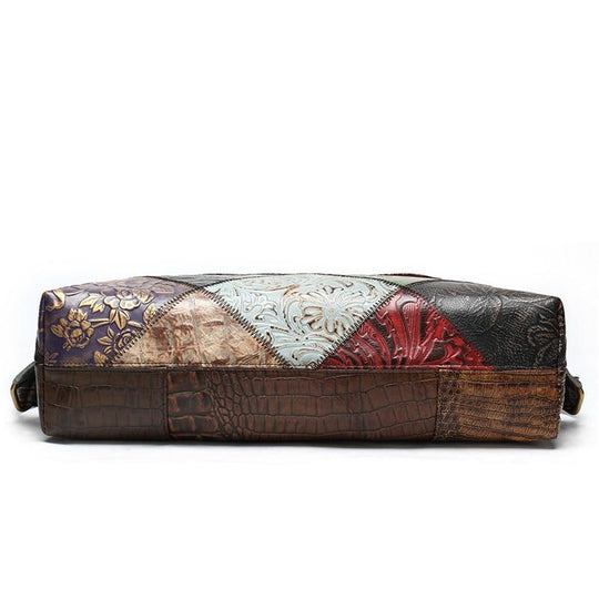 Women's sling bag with floral embossed details on leather patchwork pattern