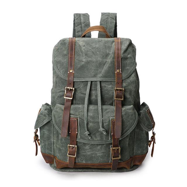 Canvas leather backpack with 14-inch laptop sleeve and luggage compartment 20-35L
