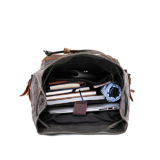 Water-resistant canvas leather student backpack in 20 to 35 liters