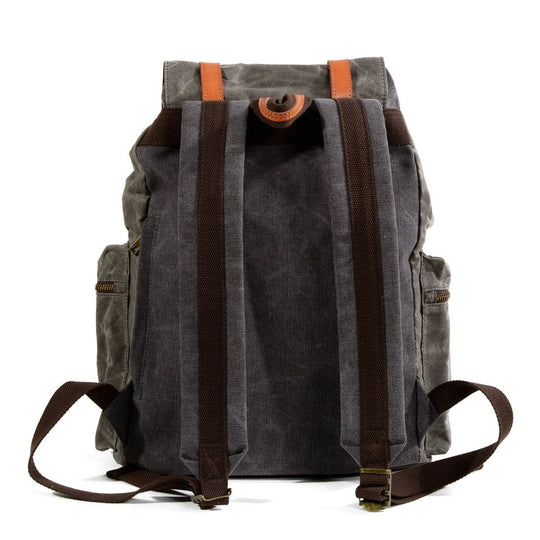Vintage-inspired black and brown waterproof canvas leather backpack