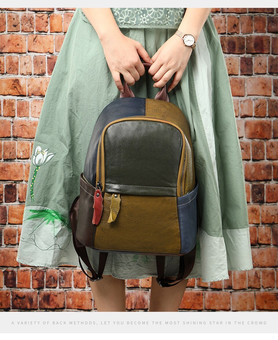 Large colorful genuine leather backpack with green, yellow, blue, and red pattern