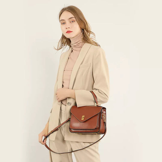Top handle leather bag with compact design